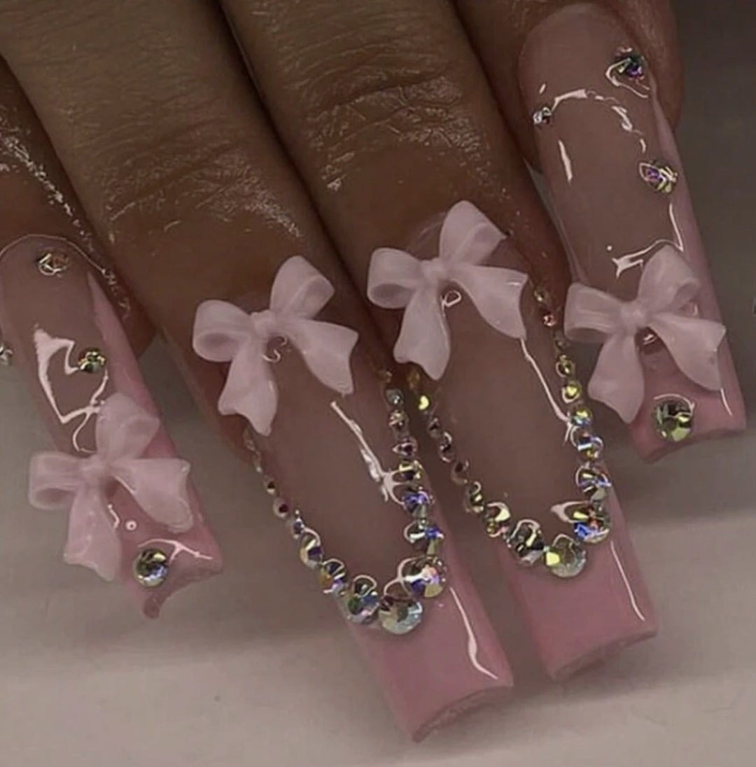 Nail art set with delicate arch decorations and rhinestone details Kalsten