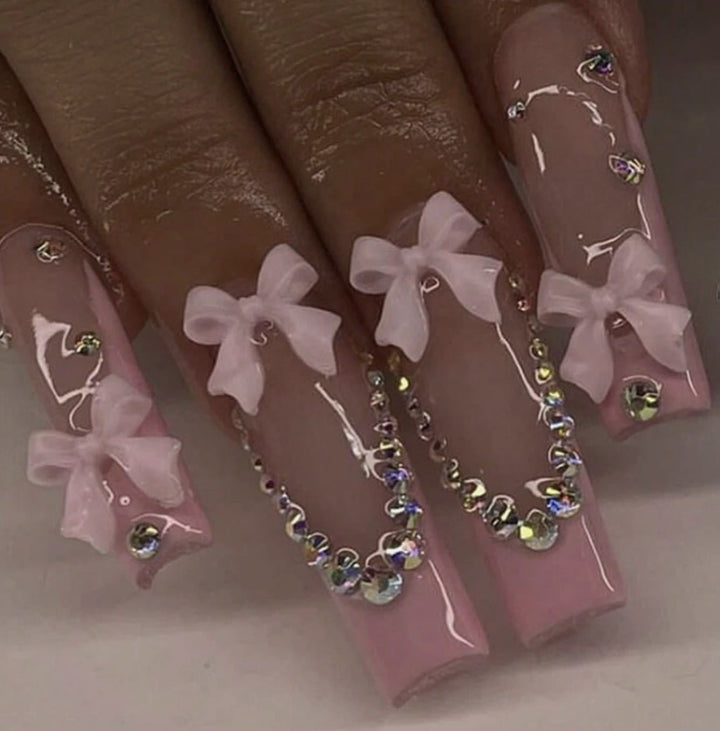 Nail art set with delicate arch decorations and rhinestone details Kalsten