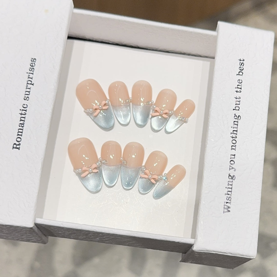 Artificial nail set with romantic bow and glitter accents Kalsten