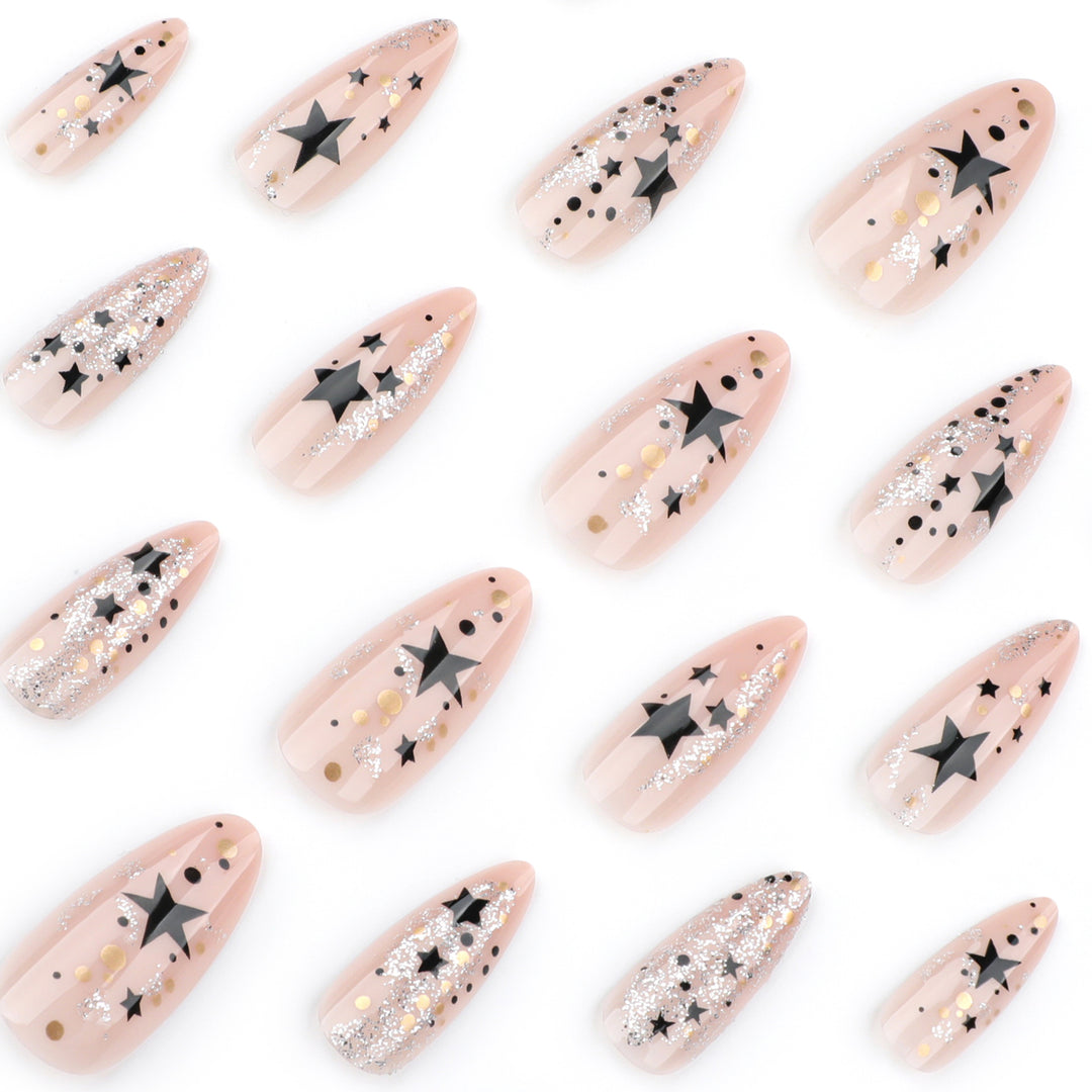 Artistic stiletto nails with glitter and star design Kalsten