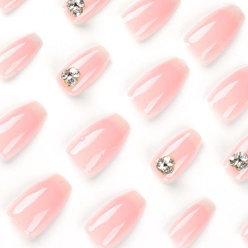 Artful nail extensions with elegant French tip and rhinestone embellishments Kalsten