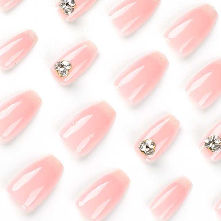 Artful nail extensions with elegant French tip and rhinestone embellishments Kalsten