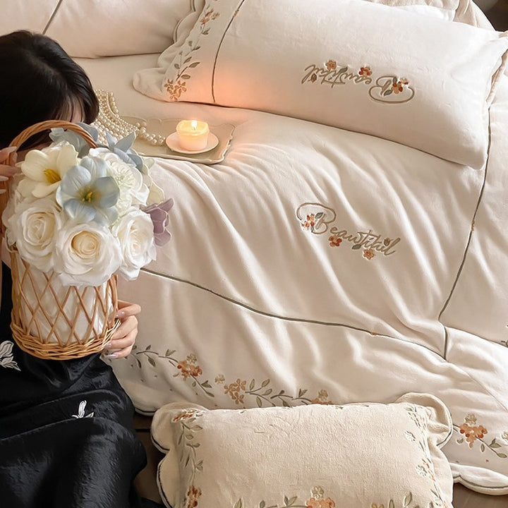 High-quality embroidered bedding set made of cotton percale with ruffled hem and floral relief