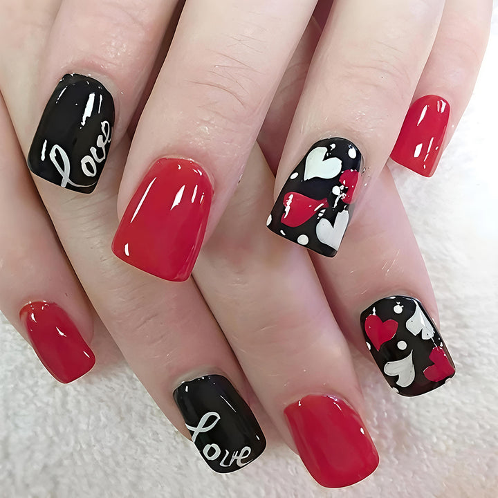 Acrylic nail design with hearts and kiss motifs Kalsten
