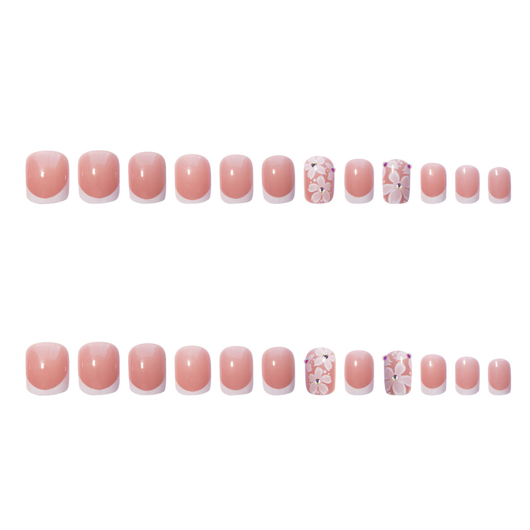 Artificial nail set with elegant French design and floral accents Kalsten