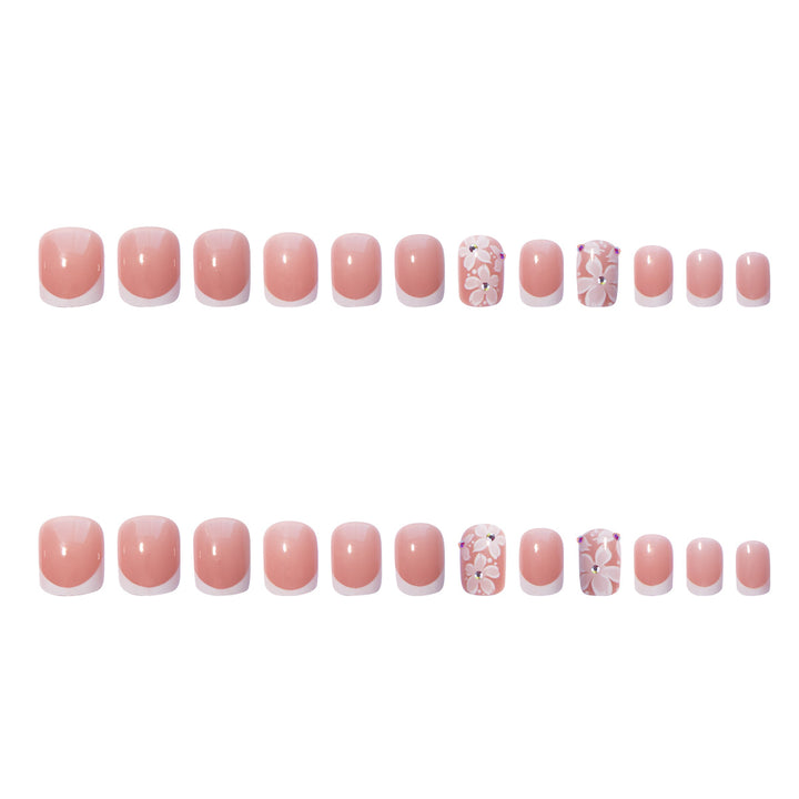 Artificial nail set with elegant French design and floral accents Kalsten