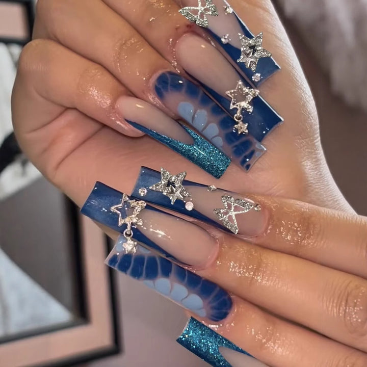 Glamorous artificial nail tips with adorned stars and glitter Kalsten