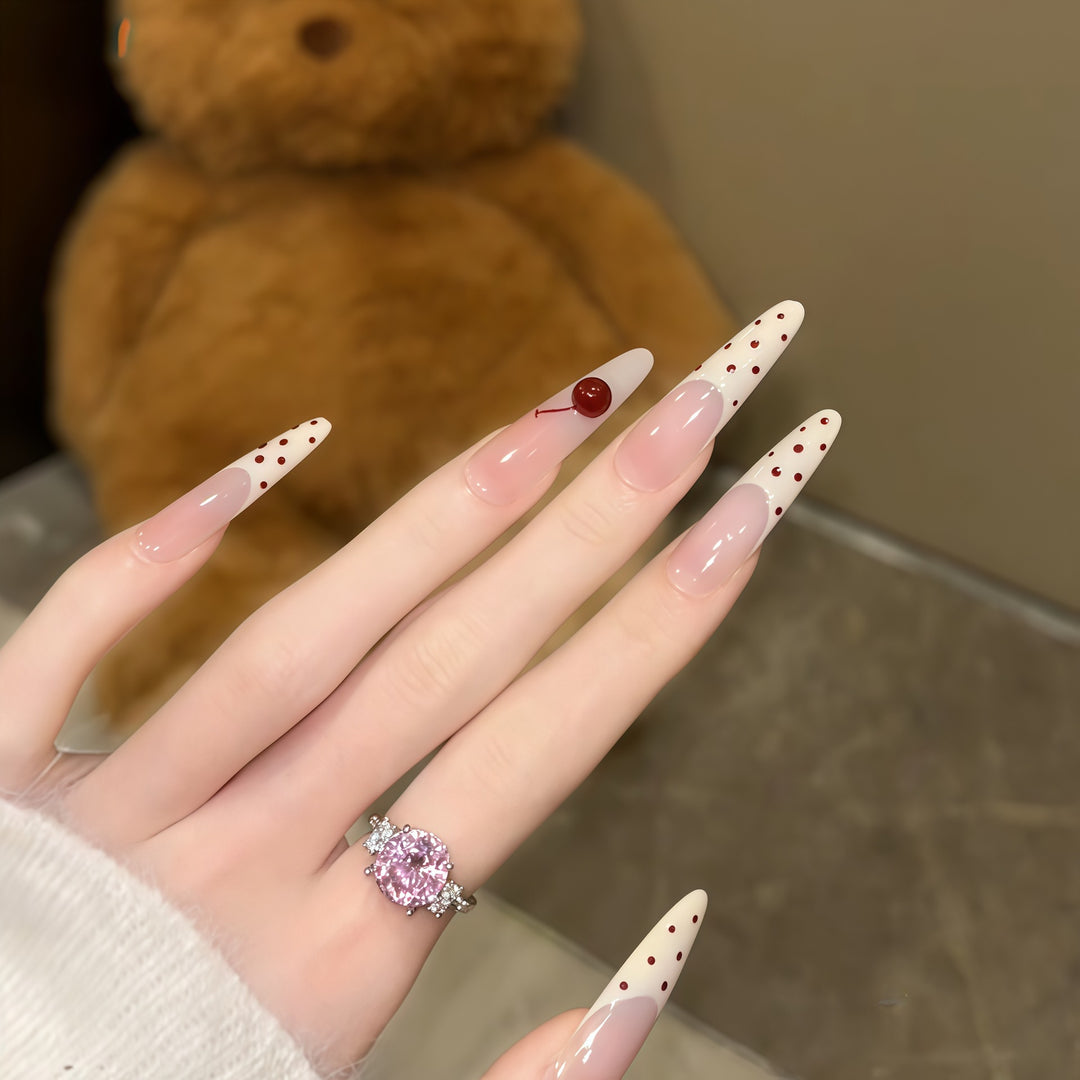 Artificial nails with playful design and cherry accents Kalsten