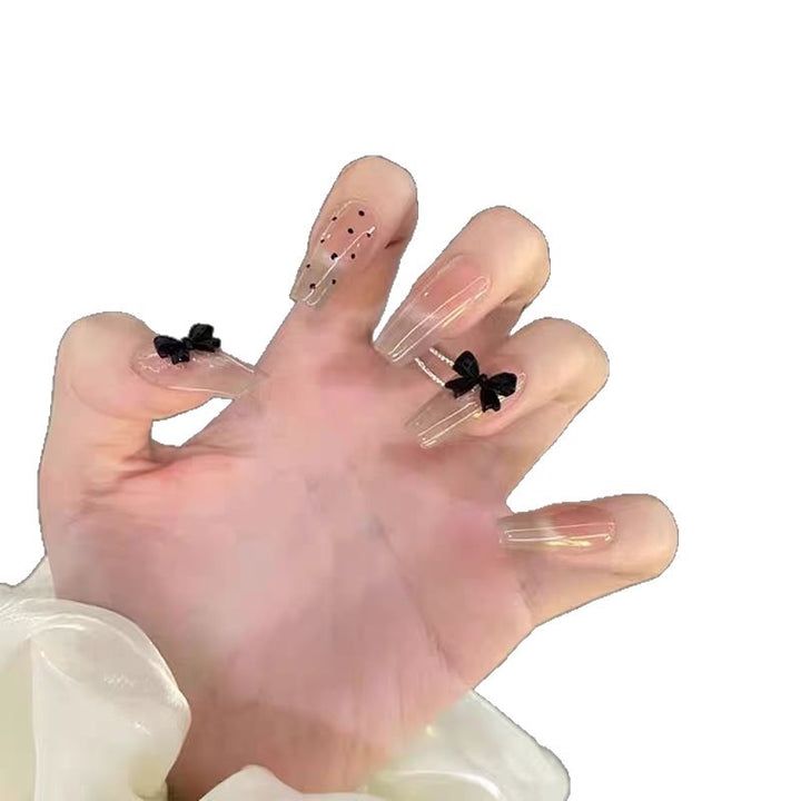 Artificial nails with playful bow design Kalsten