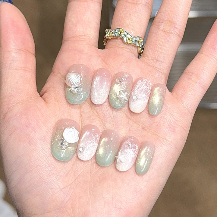 Artificial nail tips with maritime design and glitter effects Kalsten