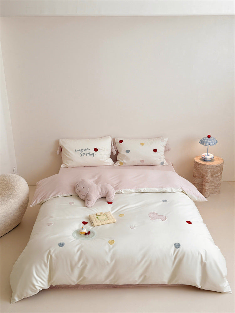 Reversible cotton satin bedding with embroidered heart appliqués and silky-matte finish Kalsten