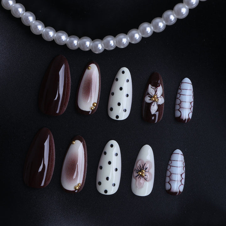 Designer artificial nails with floral and geometric accents Kalsten