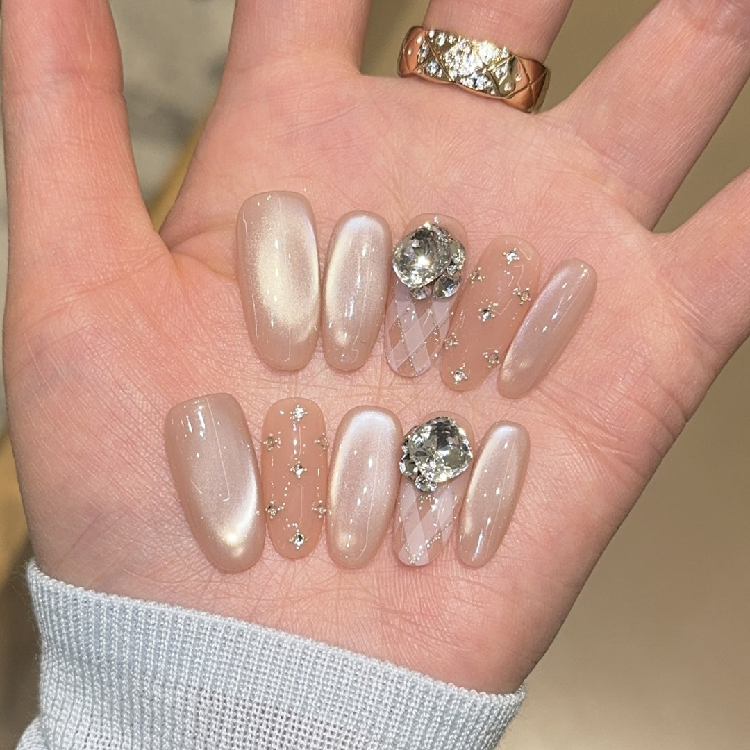 Elegant artificial nails with shimmering effects and rhinestone accents Kalsten