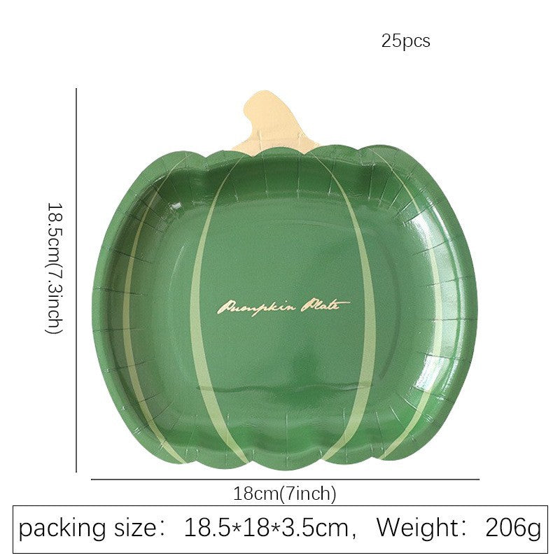 Disposable paper plates in pumpkin shape with spooky face design