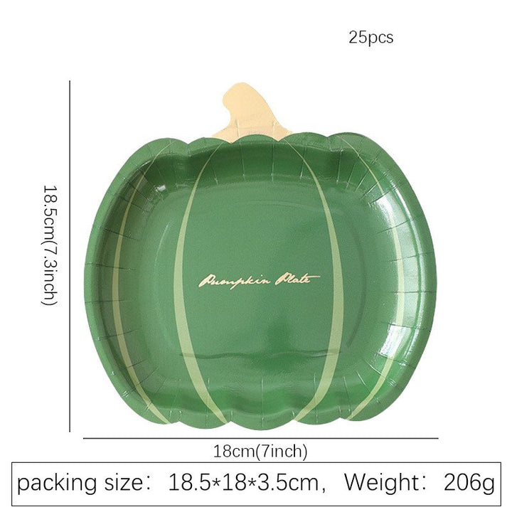 Disposable paper plates in pumpkin shape with spooky face design