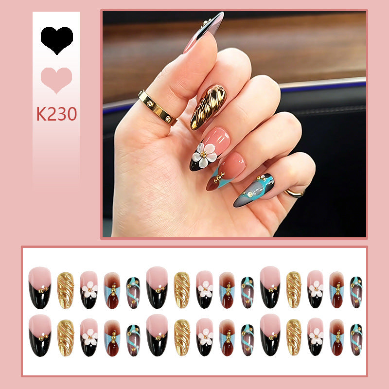 Artificial nail set with filigree floral decorations and glamorous accents Kalsten
