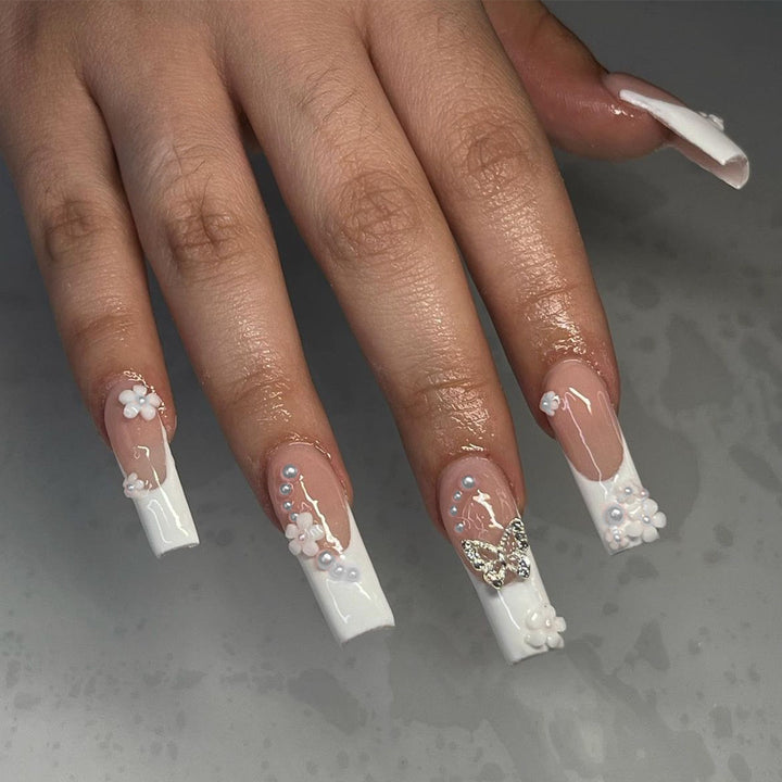 Nail art set with charming flower and butterfly accents Kalsten