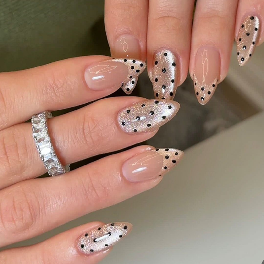 Elegant stiletto nails with glitter and dot design Kalsten