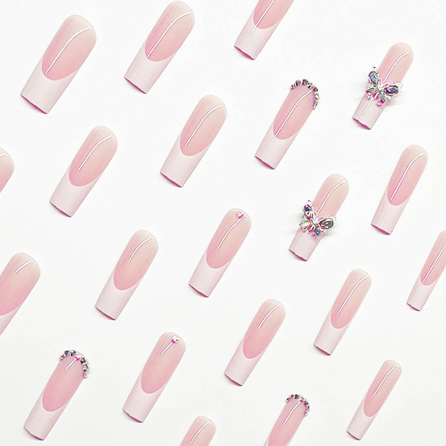 Acrylic nail set with elegant design and sparkling rhinestone accents Kalsten
