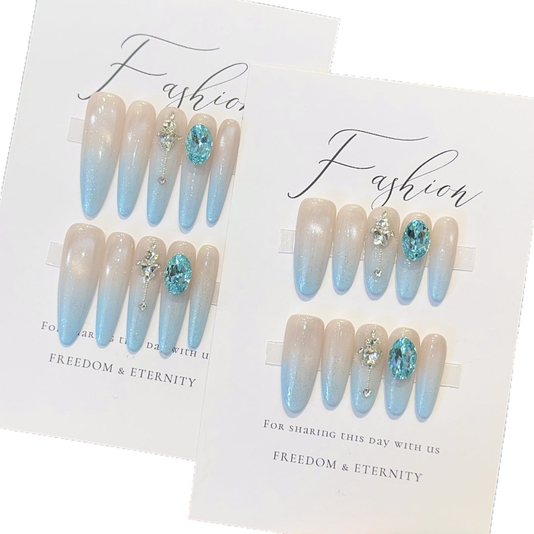 Glamorous artificial nails with sparkling rhinestone details Kalsten