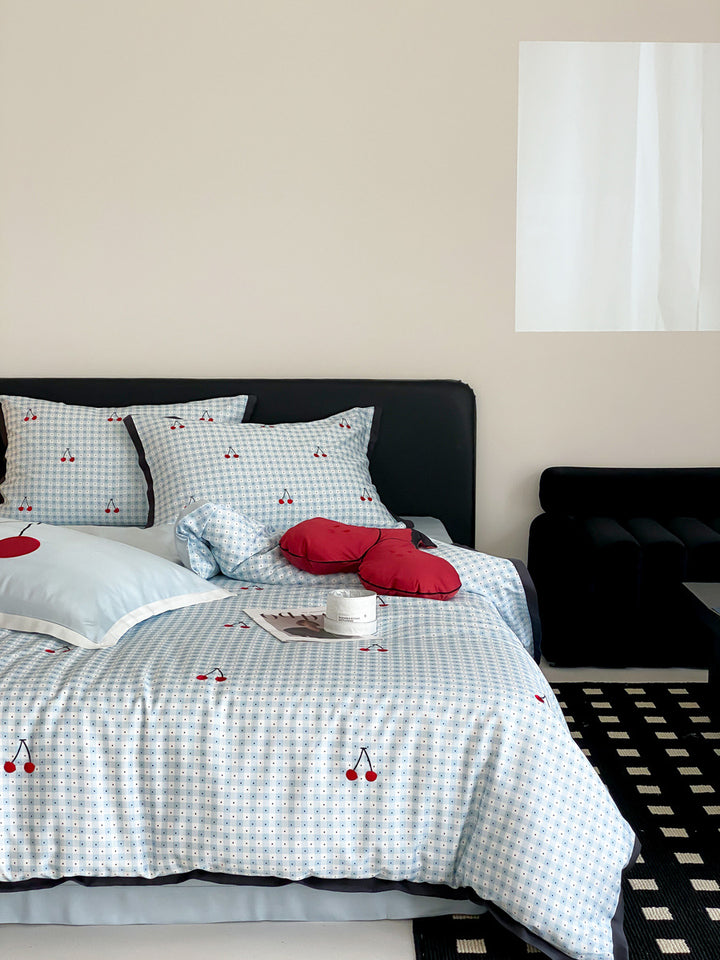 Playful cotton satin bedding set with cherry print and fine check pattern