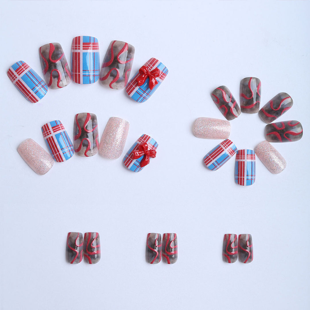 Artificial nails with festive gift design and glitter Kalsten