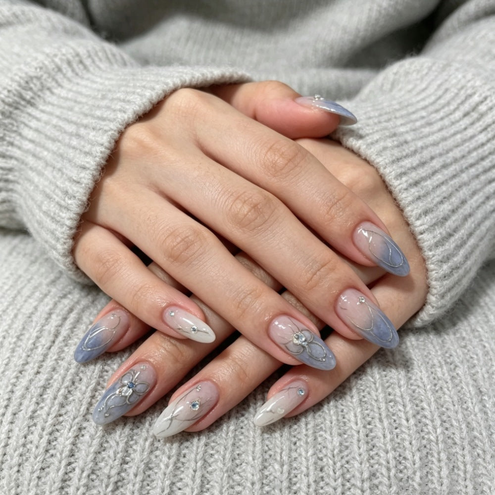 Artistic Press-On Nail Design with Floral and Gem Accents Kalsten