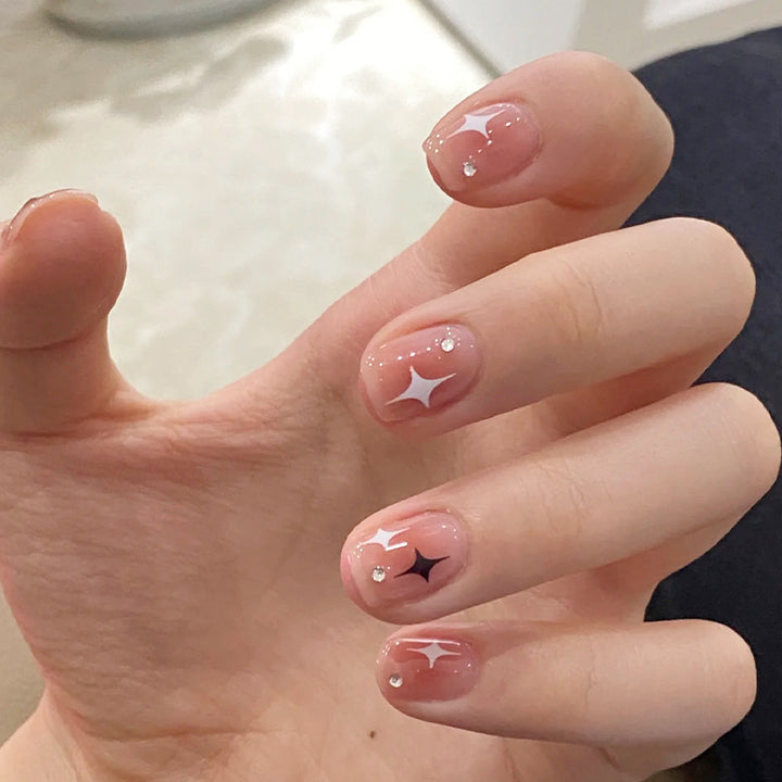 Acrylic nail set with sparkling star decorations and elegant accents Kalsten