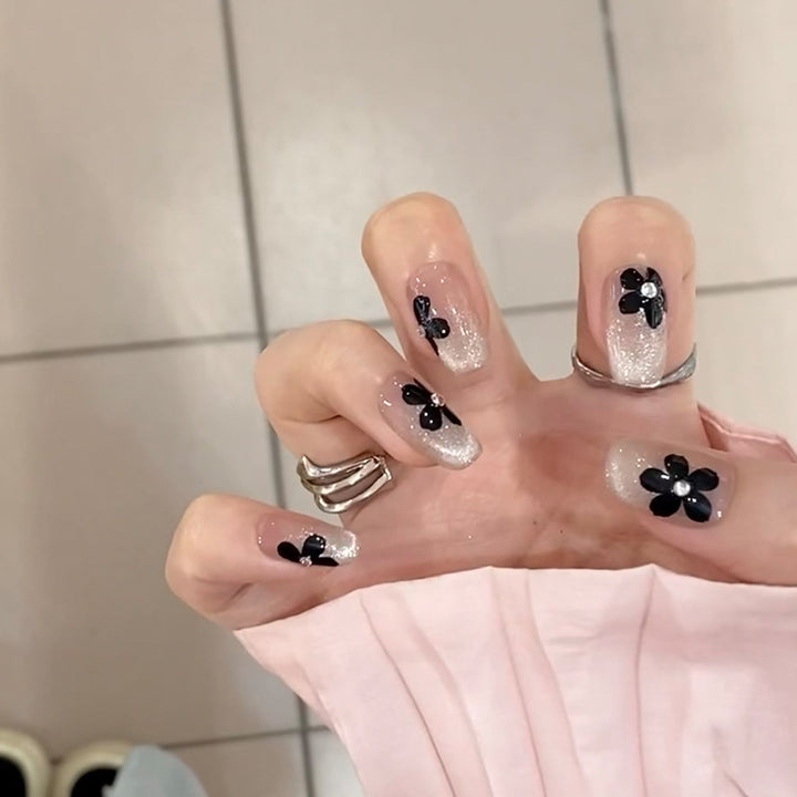 Artificial nail set with elegant flower design and glamorous accents Kalsten