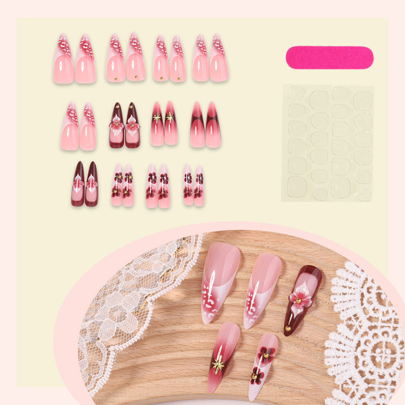 Artifical nail set with delicate floral design and glamorous accents Kalsten