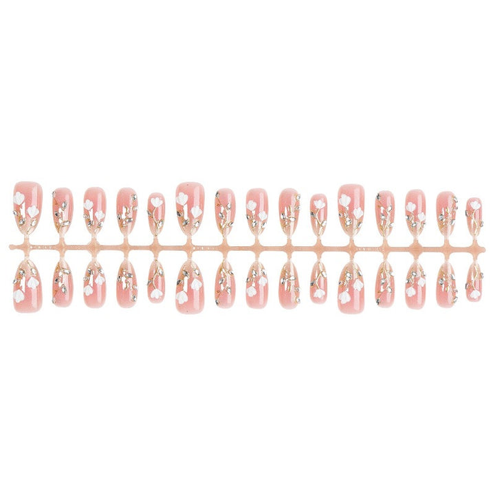 Artificial nail set with delicate floral patterns and elegant accents Kalsten