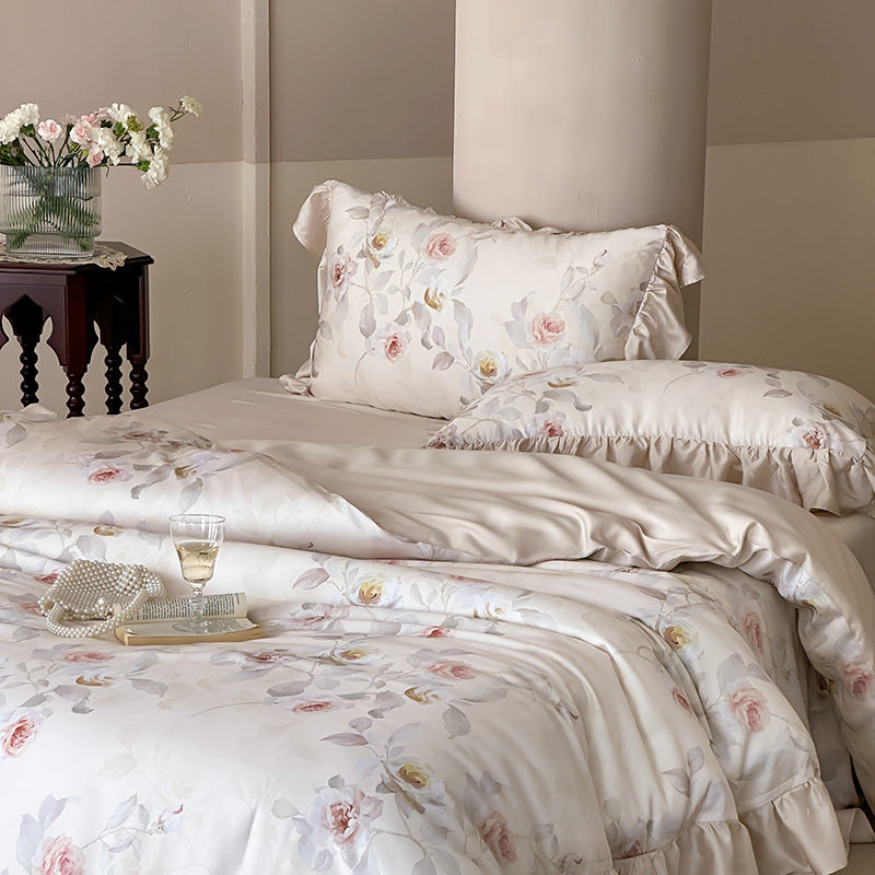 Luxurious satin bedding set with ruffled pillows and delicate watercolor rose print