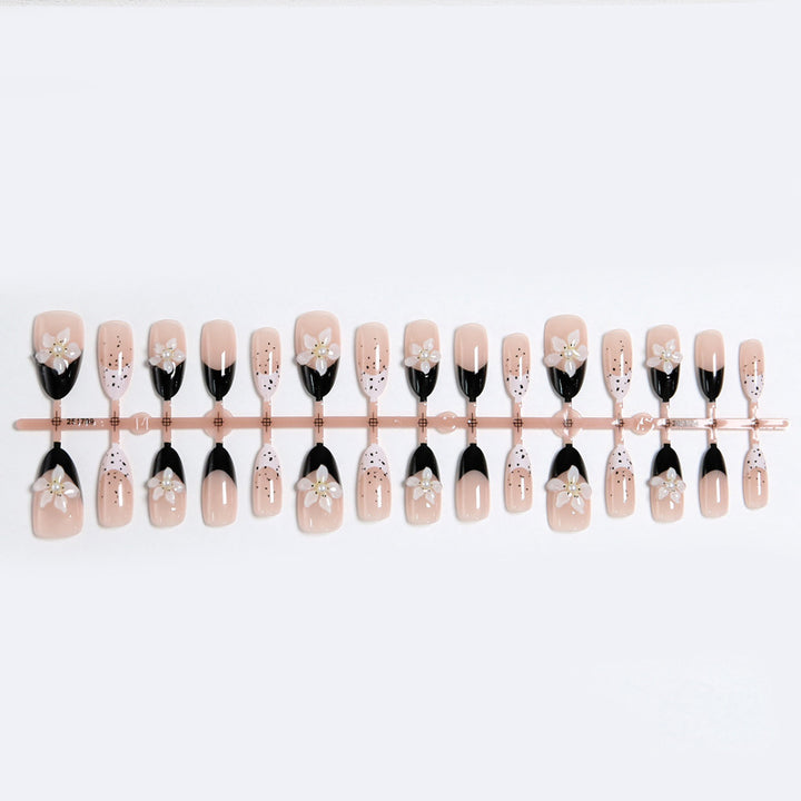 Artful nail tips with floral embellishments Kalsten