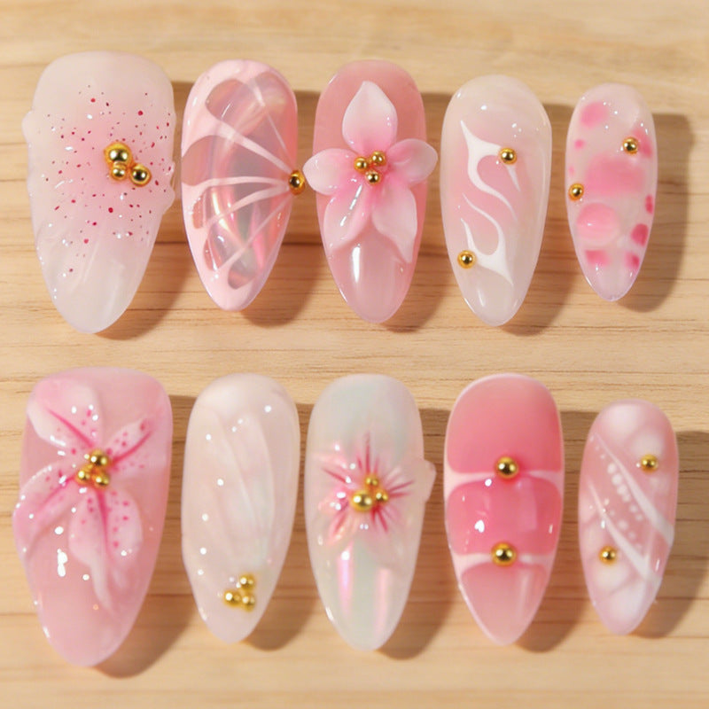 Artificial nails with floral designs and glitter accents Kalsten