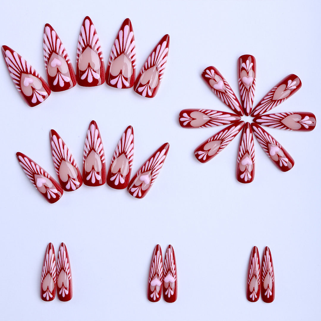Artificial nails with playful heart design and elegant accents Kalsten