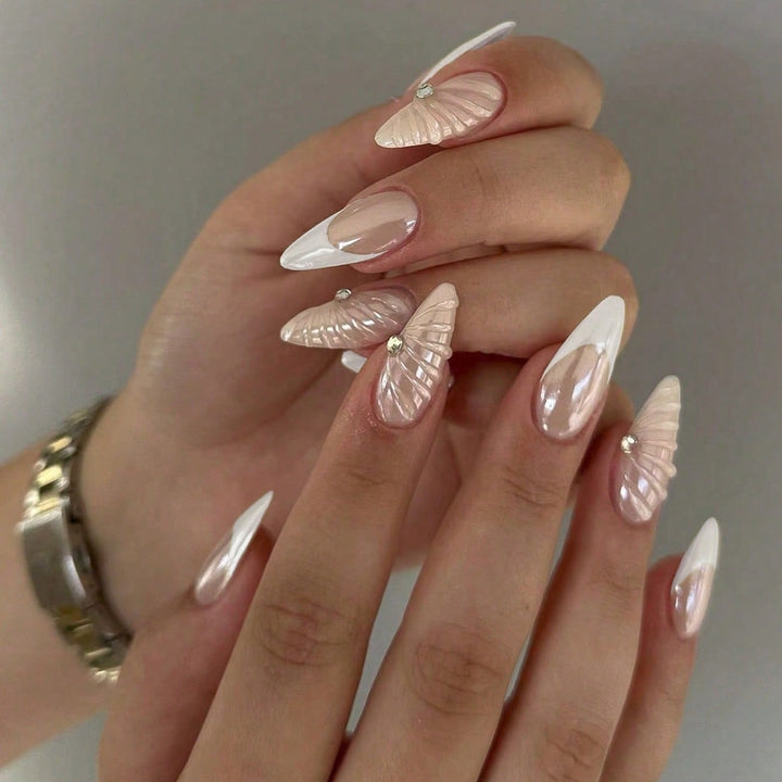 Artificial nail set with elegant shell pattern and glitter accents Kalsten