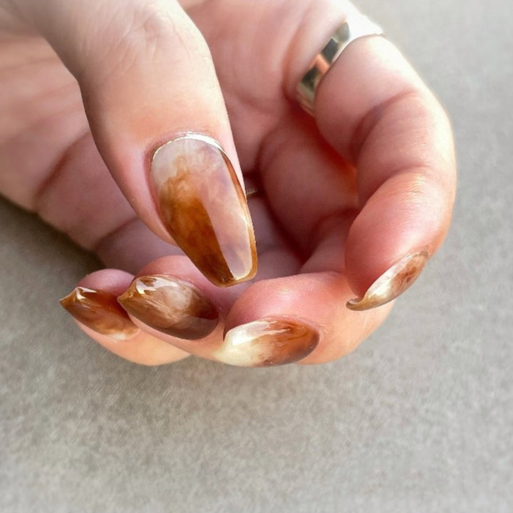 Artful nail extensions with an elegant leaf pattern Kalsten