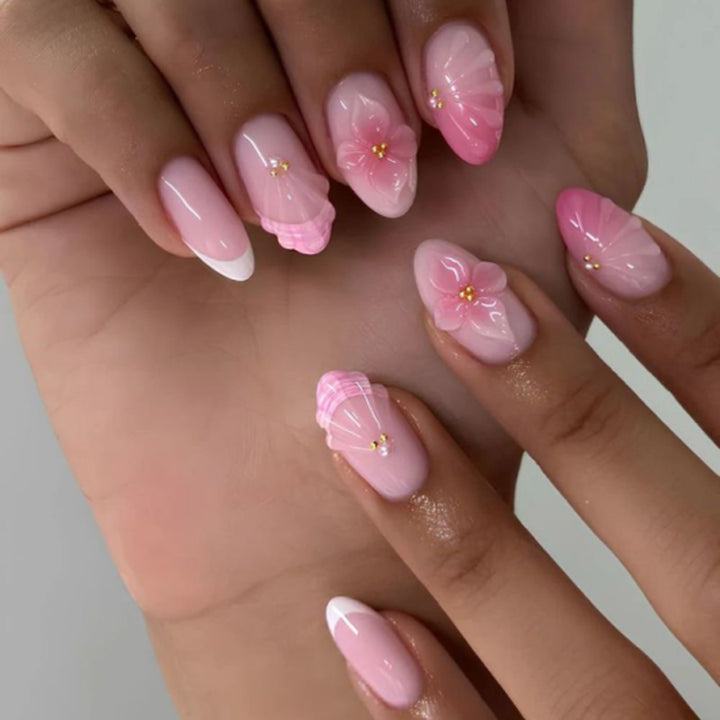 Artful stiletto nails with elegant floral design and glitter details Kalsten