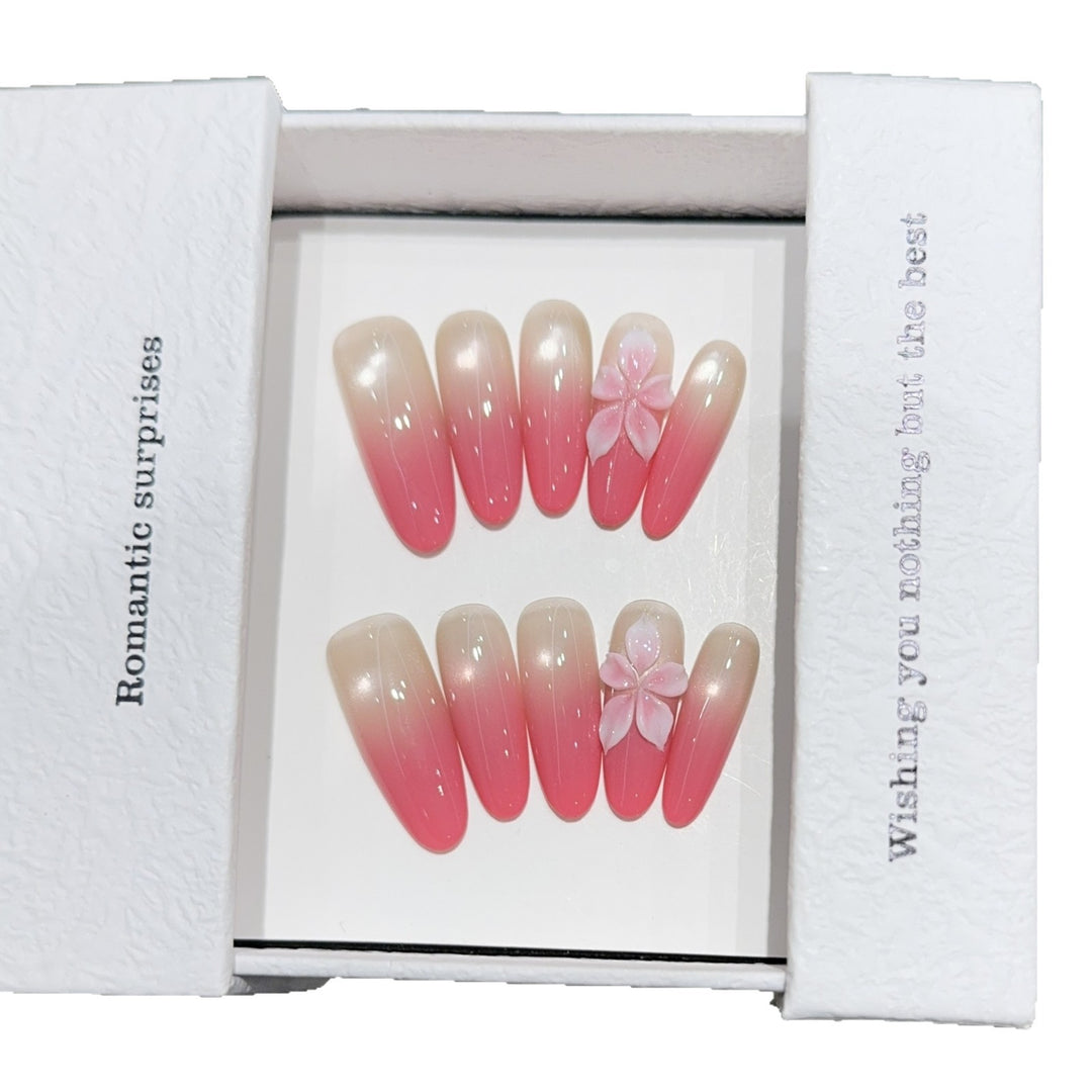 Artificial nails with romantic ombre design and floral accents Kalsten