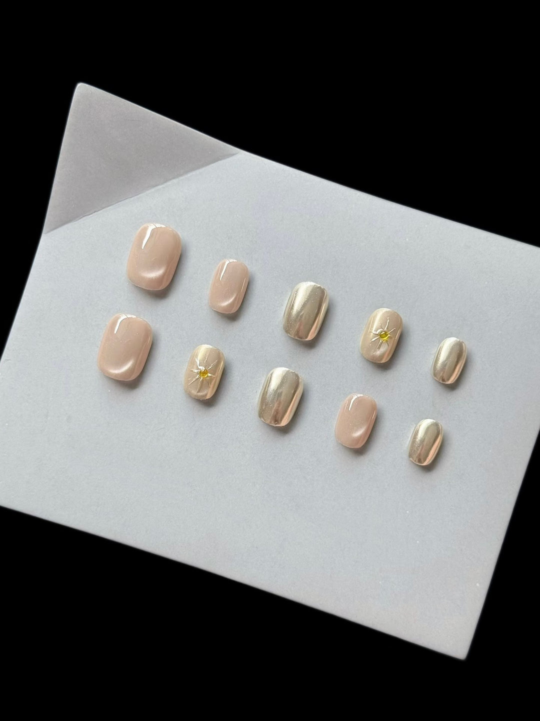 Artistic Press-On Nail Set with Decorative Metallic Accents