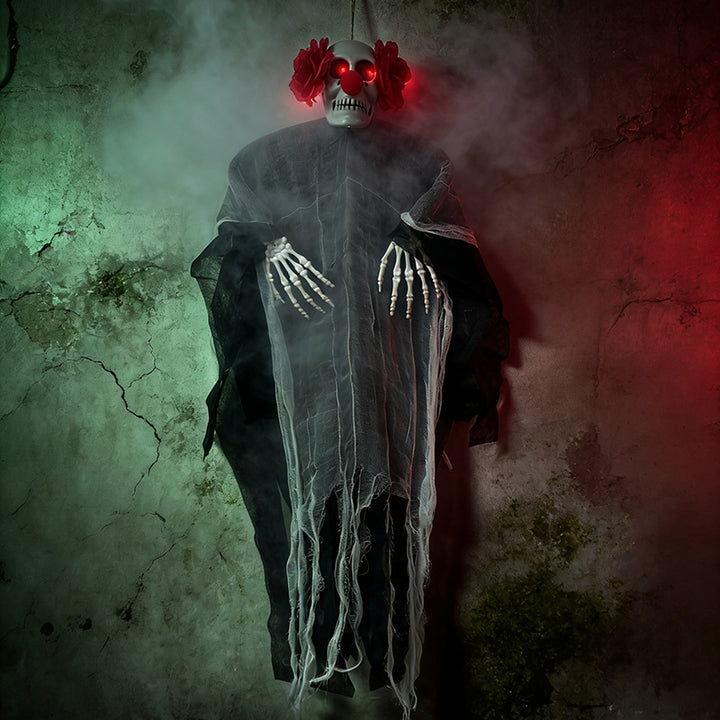 Creepy hanging decoration skeleton with glowing eyes