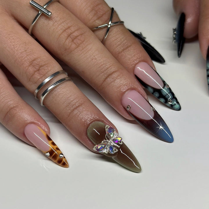 Artful nail extensions with elegant designs and glitter Kalsten