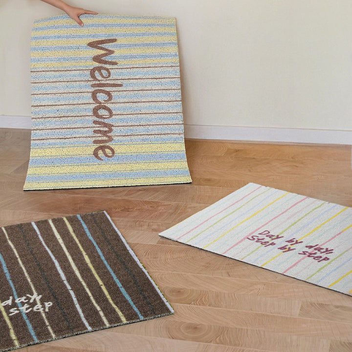 Durable entrance doormat with striped texture and "Welcome" lettering Kalsten