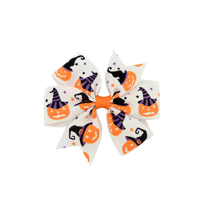 Halloween bow with pumpkin and witch motifs