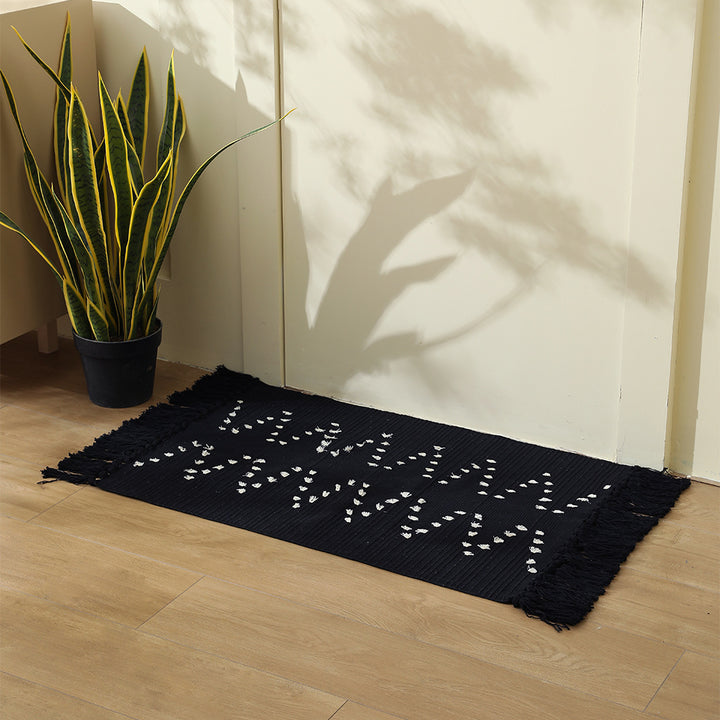 handwoven living room rug with fringes and geometric perforated pattern Kalsten