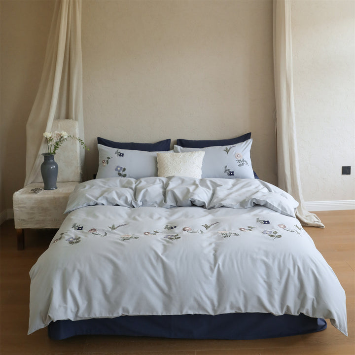 Embroidered cotton bedding set with delicate wildflower embroidery and percale texture