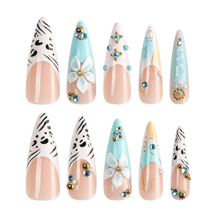 Artistic stiletto nails with floral accents and glitter details Kalsten
