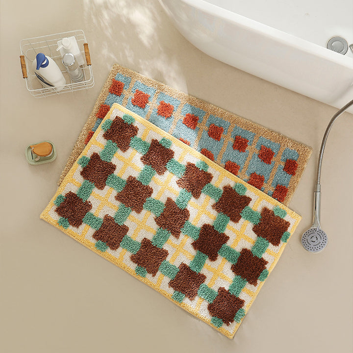 Hand-tufted bathroom bath mat with non-slip backing and textured square relief Kalsten