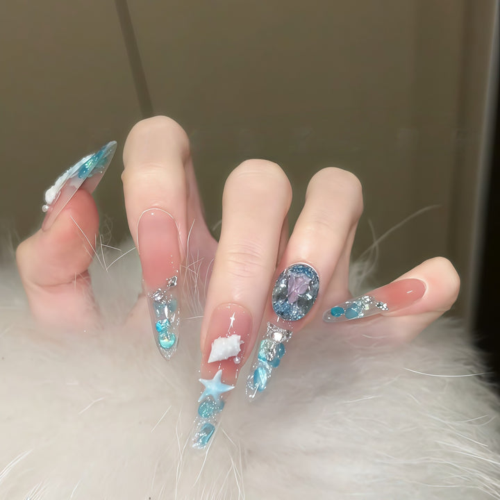 Creative artificial nails with maritime designs and sparkling accents Kalsten
