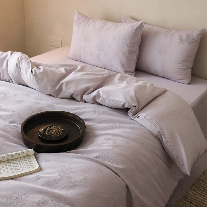 Exclusive cotton satin bedding set with tonal floral jacquard and fine decorative embroidery